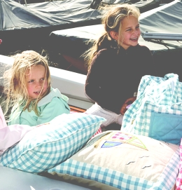 girls-in-boat-with-cushions.jpg
